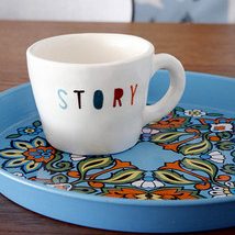 mug with "story" written in colorful letters